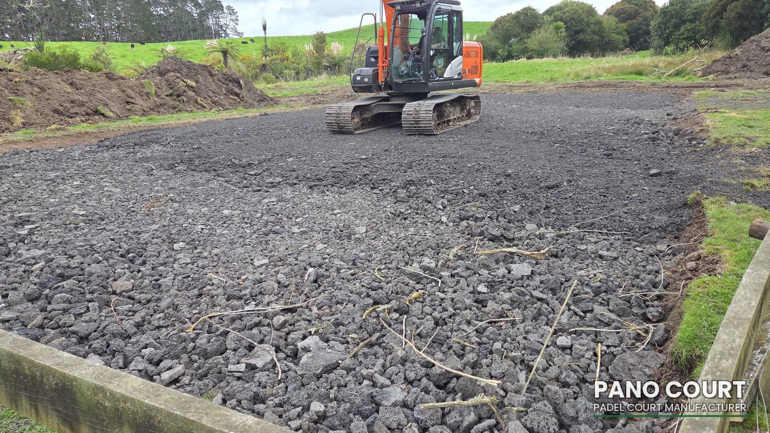 Compacted aggregate sub-base laid to padel court foundation requirements before the concrete slab